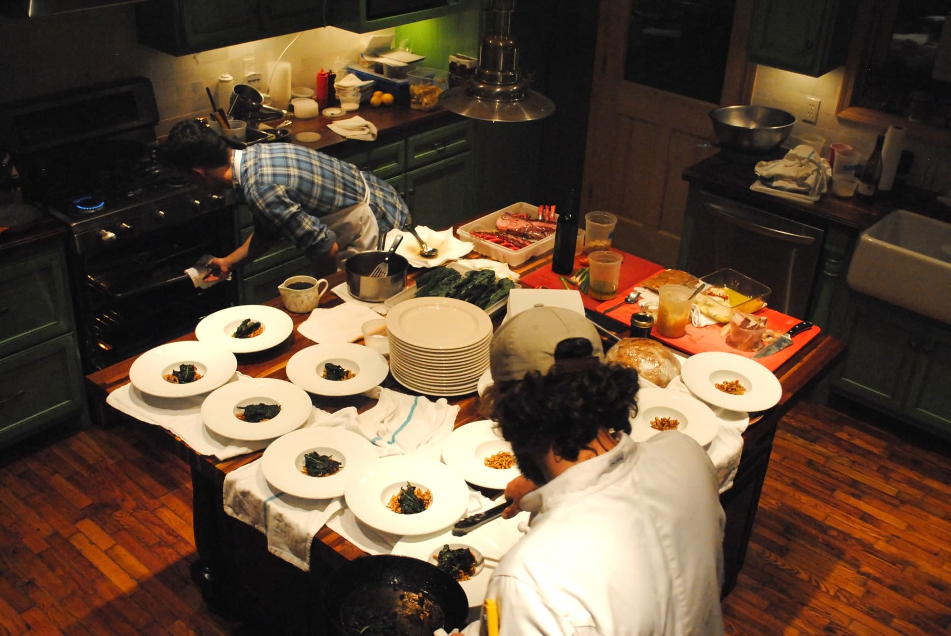 Group cooking together in the farmhouse kitchen